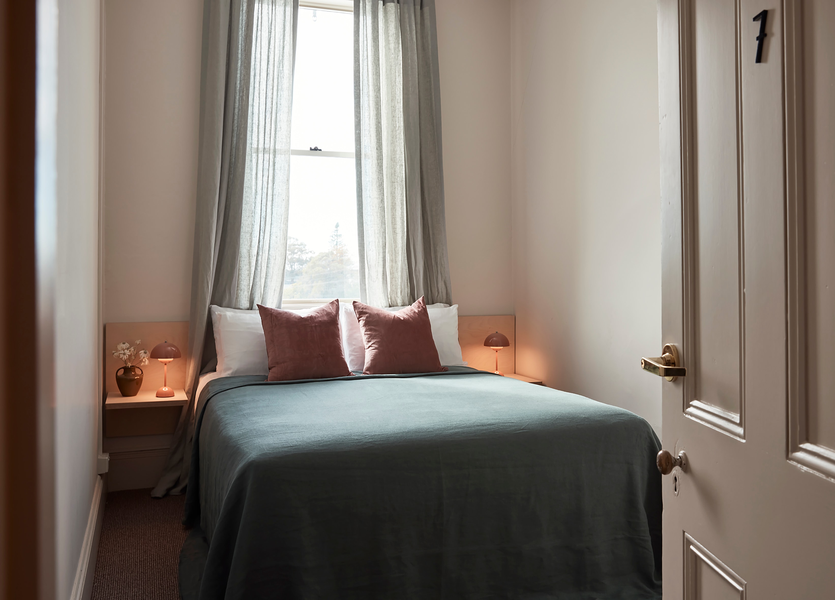 Warm, minimal retreat accommodation interior
